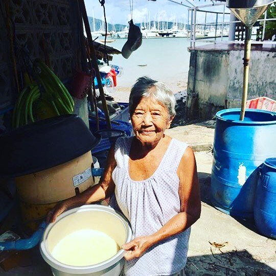 Mama showing us the fresh coconut milk